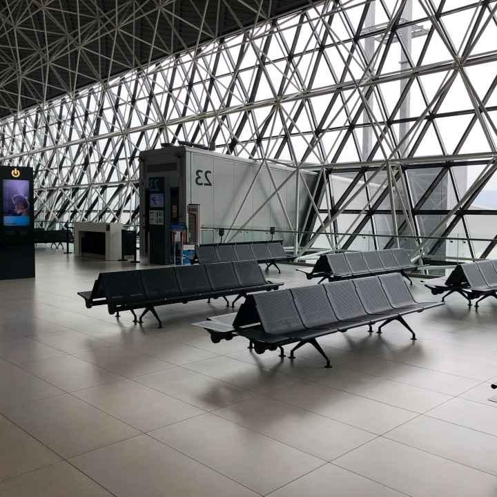 Photo of empty waiting area near an airport terminal
